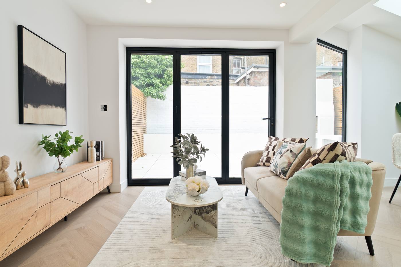 Open-plan living room with garden glazing
